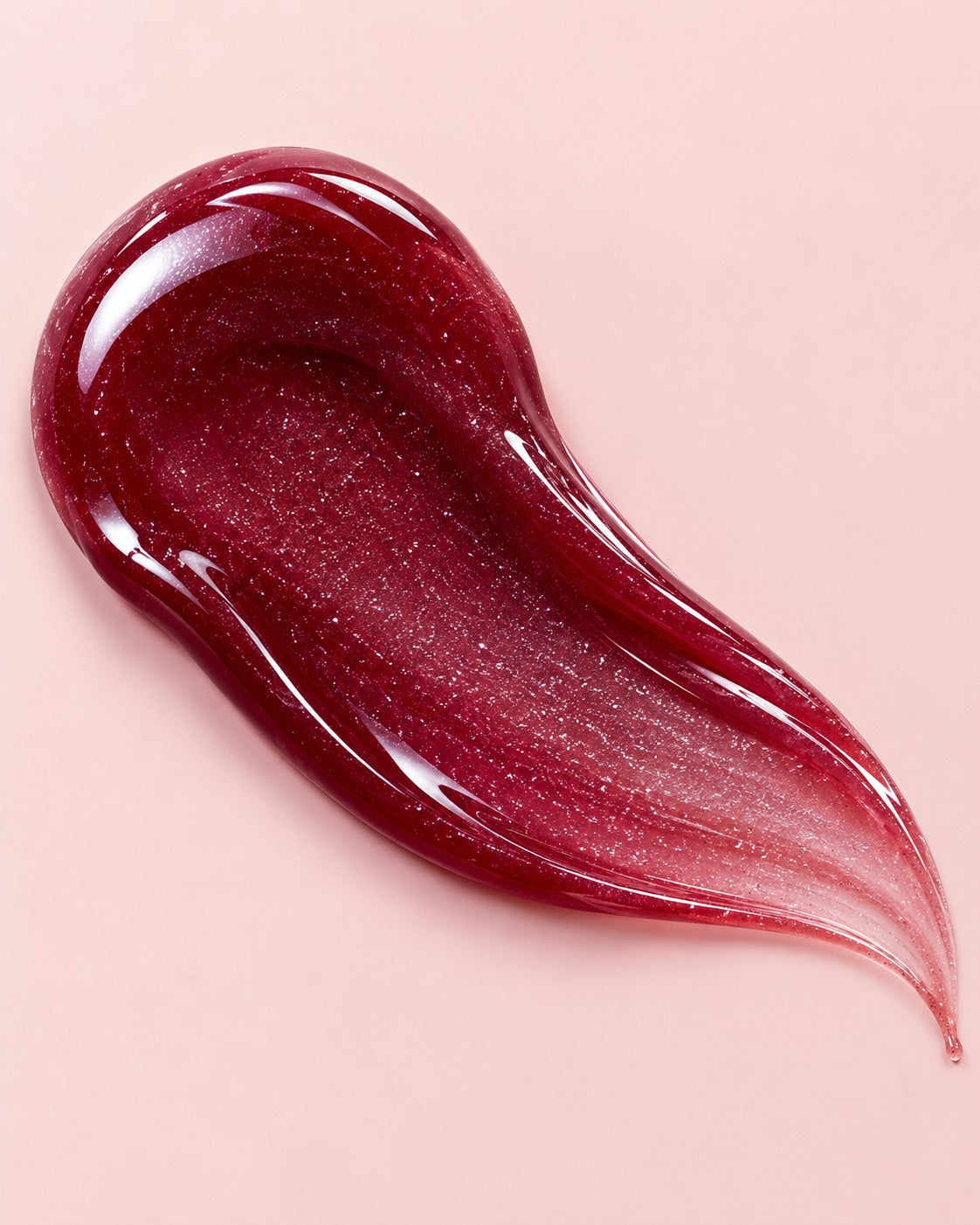 Noir lip gloss swatch — deep berry shimmer